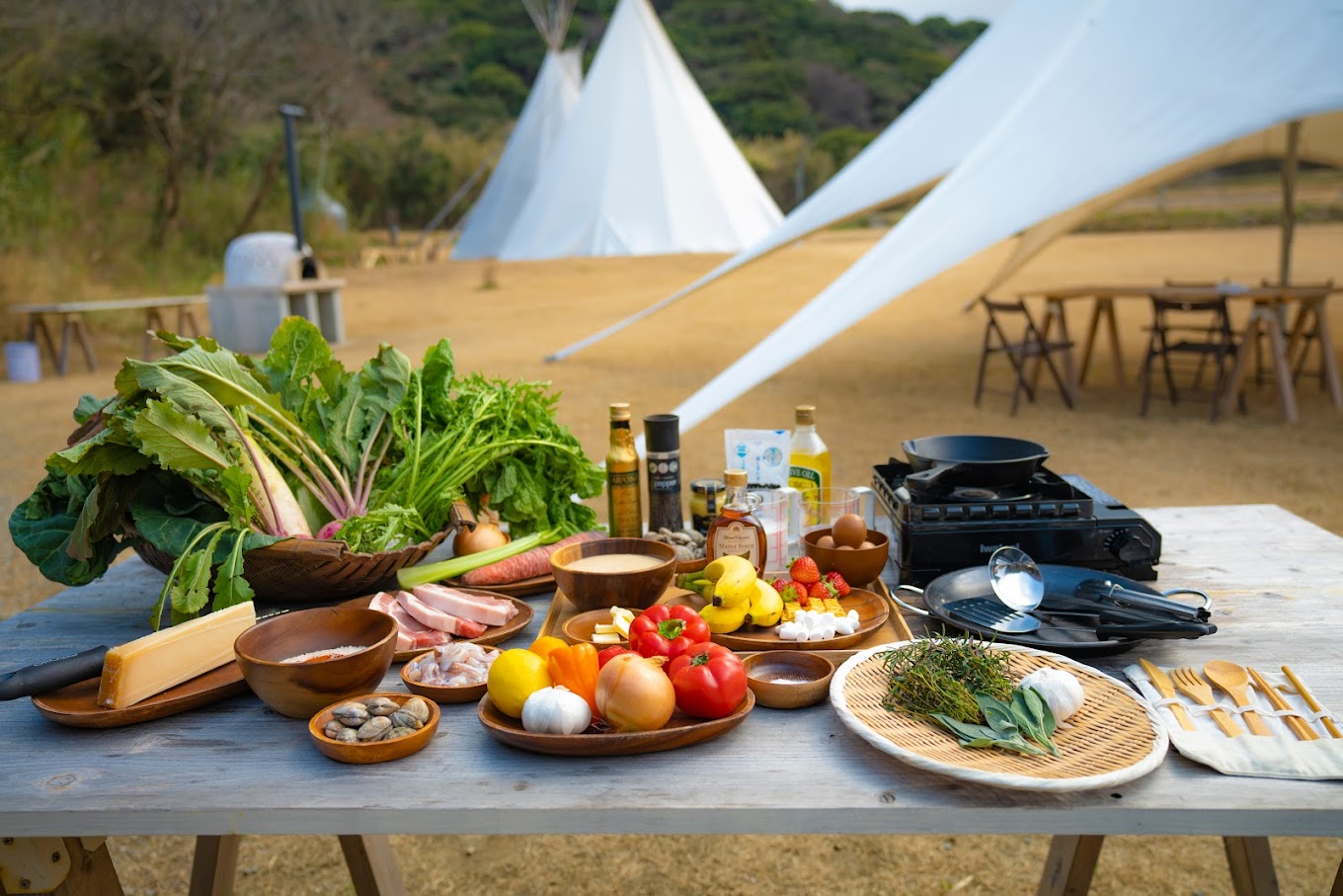 Lit glamping tents under the night sky