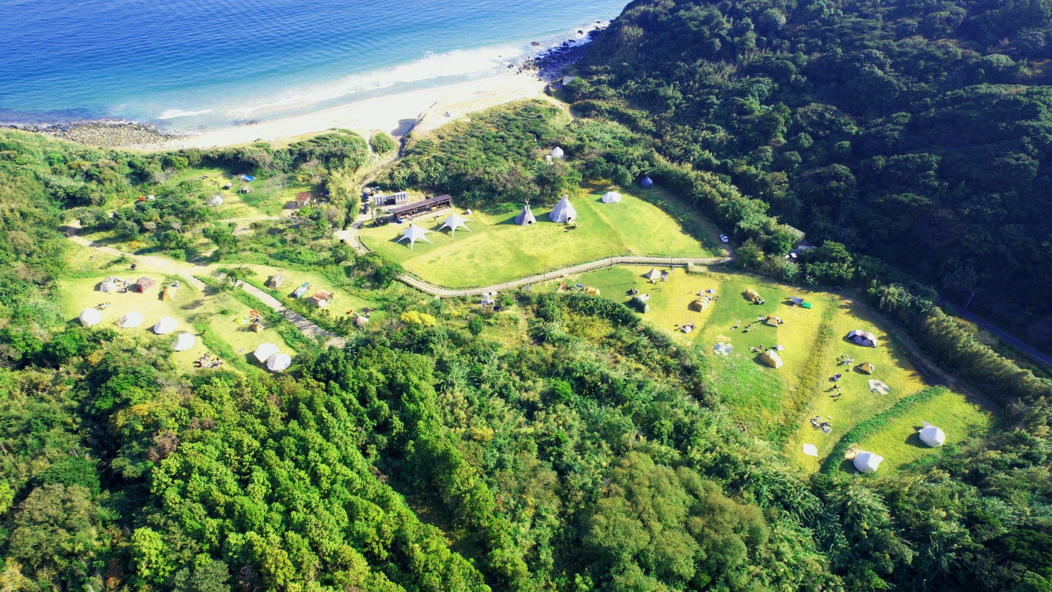 Wide aerial image of the festival grounds and surrounding landscape